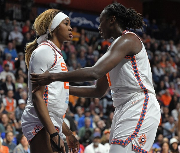 Sun veteran Tina Charles, right, tries to settle Aneesah Morrow after the rookie took a hard foul from the Mercury's Satou Sabally during Connectoicut's 87-84 win over Phoenix on Saturday at Mohegan Sun Arena. (Sean D. Elliot/Getty Images)