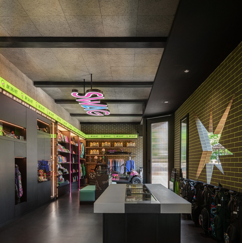 monochrome surfaces and neon accents outline swag golf bangkok flagship - 8