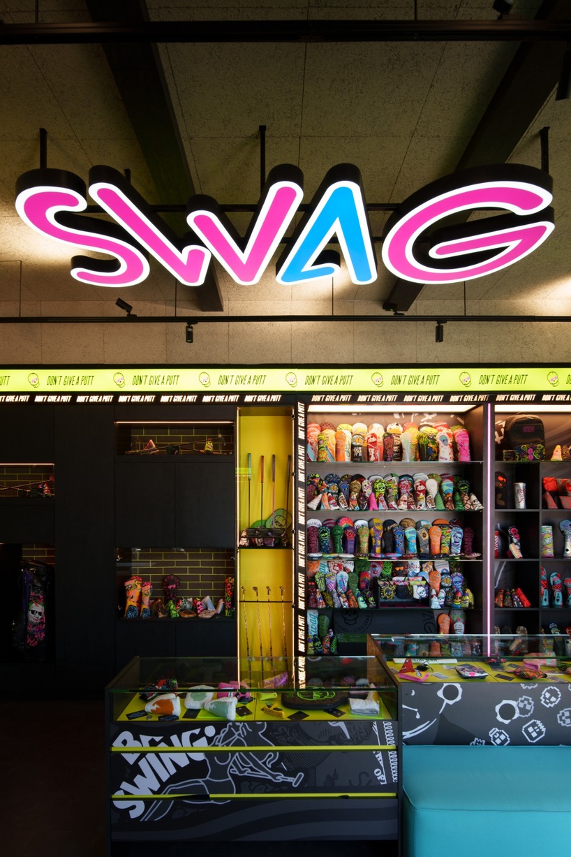 monochrome surfaces and neon accents outline swag golf bangkok flagship - 5