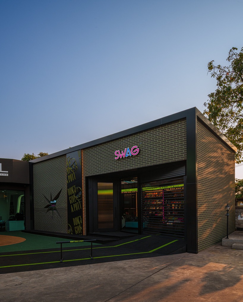 monochrome surfaces and neon accents outline swag golf bangkok flagship - 2