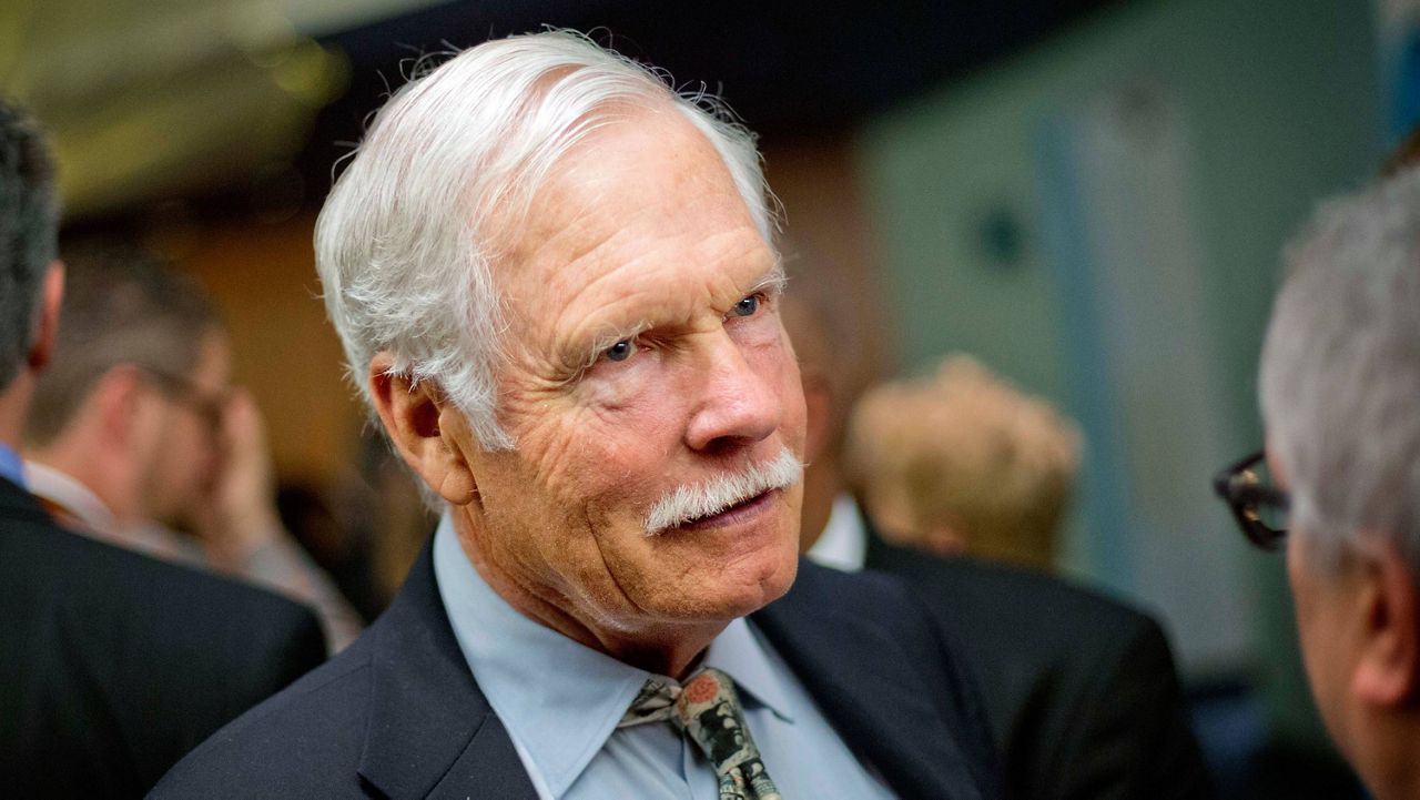 In this Dec. 6, 2013, file photo, Ted Turner talks with guests at the Captain Planet Foundation benefit gala in Atlanta. (AP Photo/David Goldman, File)