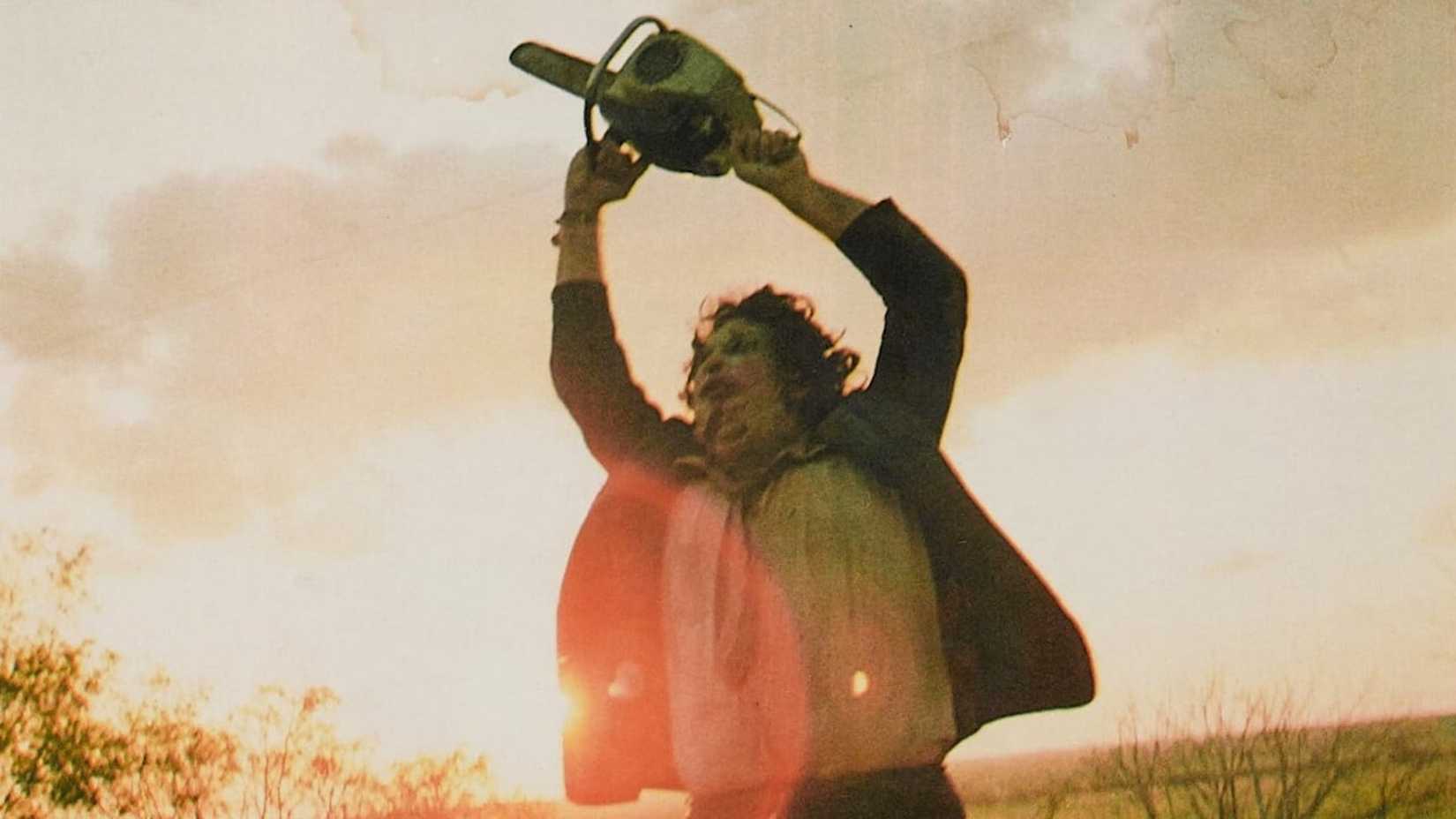 Leatherface angrily swings his chainsaw in The Texas Chainsaw Massacre