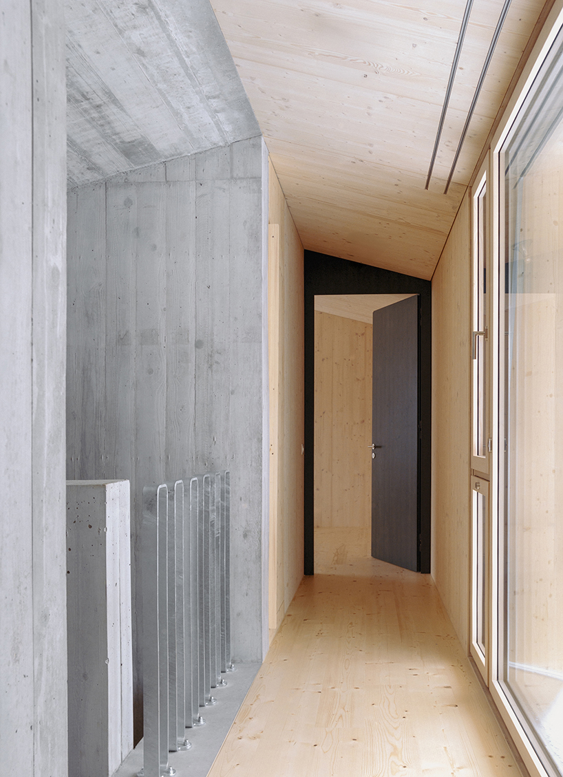 the tower house explores vertical living through prefabricated timber design 10