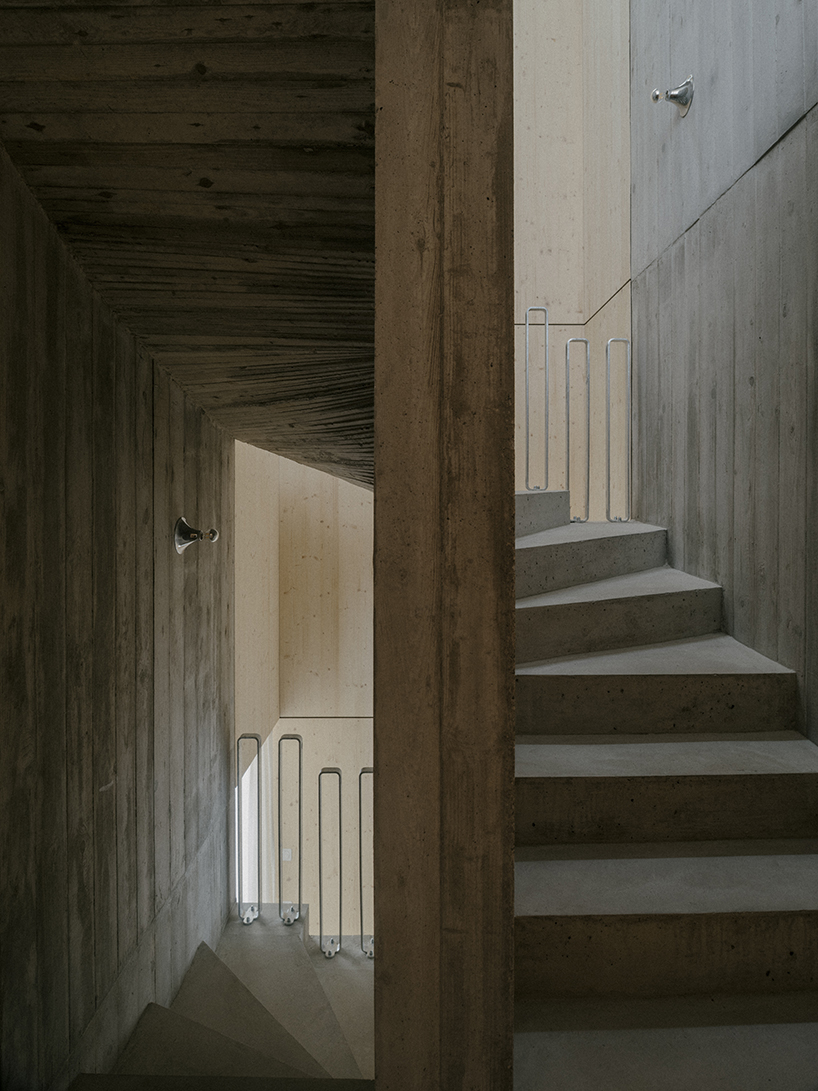 the tower house explores vertical living through prefabricated timber design 9