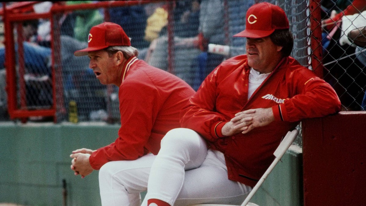 Cincinnati Reds manager Pete Rose and coach Tommy Helms watching baseball game action