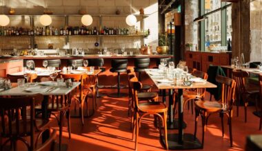 red floor anchors parisian restaurant ypseli with steel and marble textures