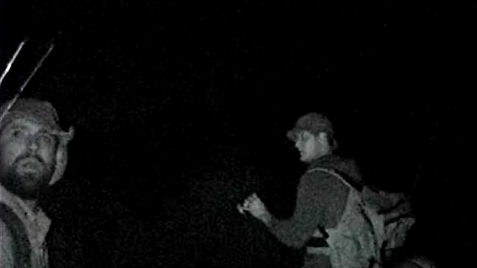 Two bewildered campers walking around the desert in the pitch black in The Phoenix Tapes 97