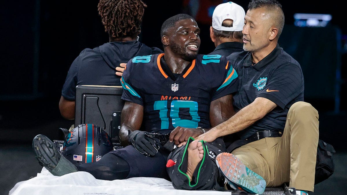 Tyreek Hill being carted off the field at Hard Rock Stadium