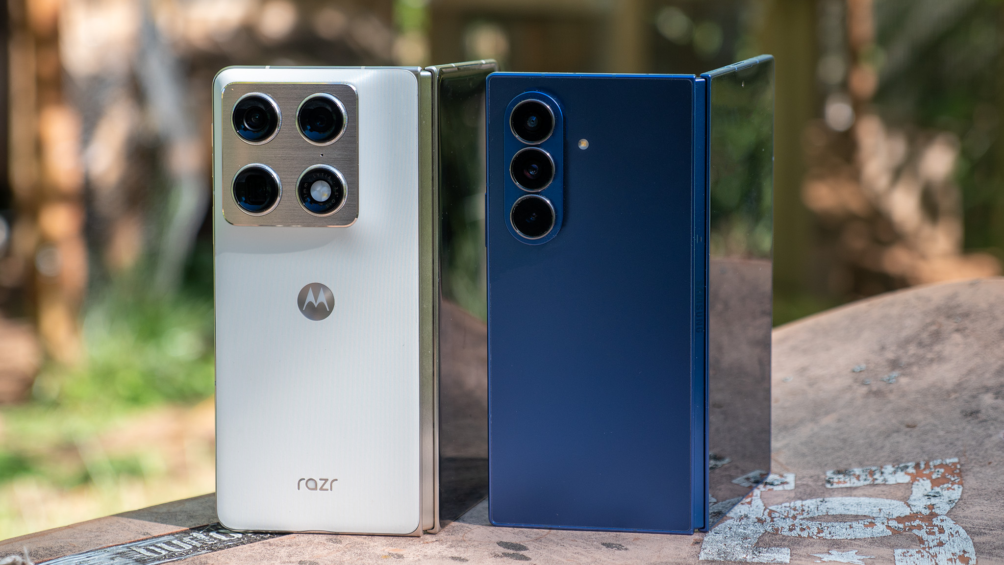 Comparing the blue Samsung Galaxy Z Fold 7 with the white Motorola Razr Fold 2026