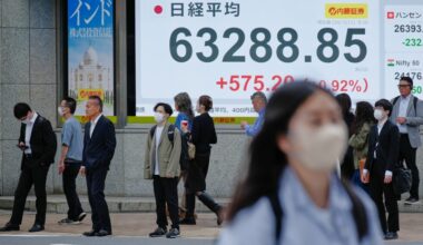 Oil jumps 3% and Asian shares are mixed after Wall Street set records