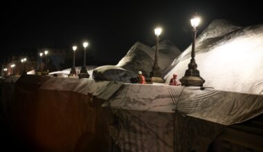 Artist JR begins cave installation at Pont Neuf bridge in Paris