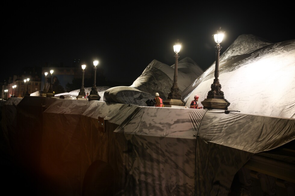 Artist JR begins cave installation at Pont Neuf bridge in Paris