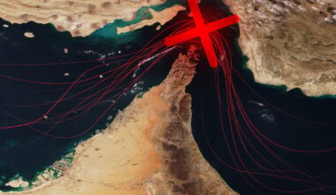 A map of Hormuz with a red X showing the strait is blocked