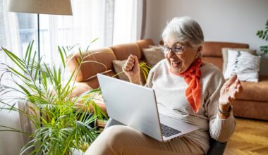 Excited person looking at laptop.