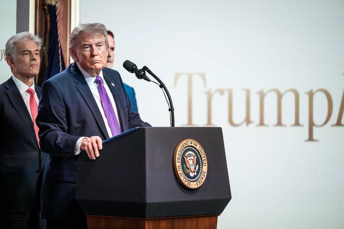 President Trump is shown at a podium.