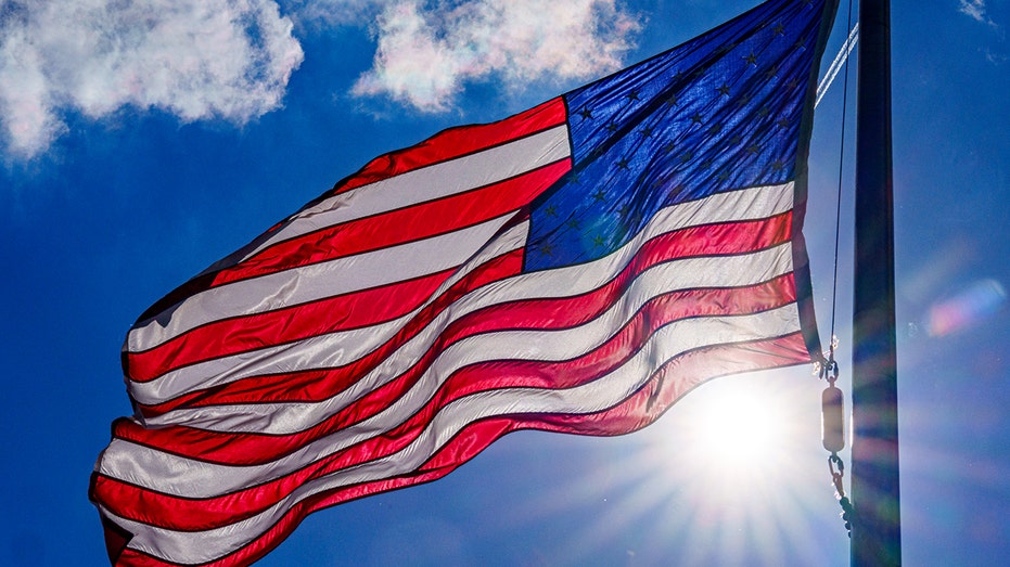 US flag flying in sunshine