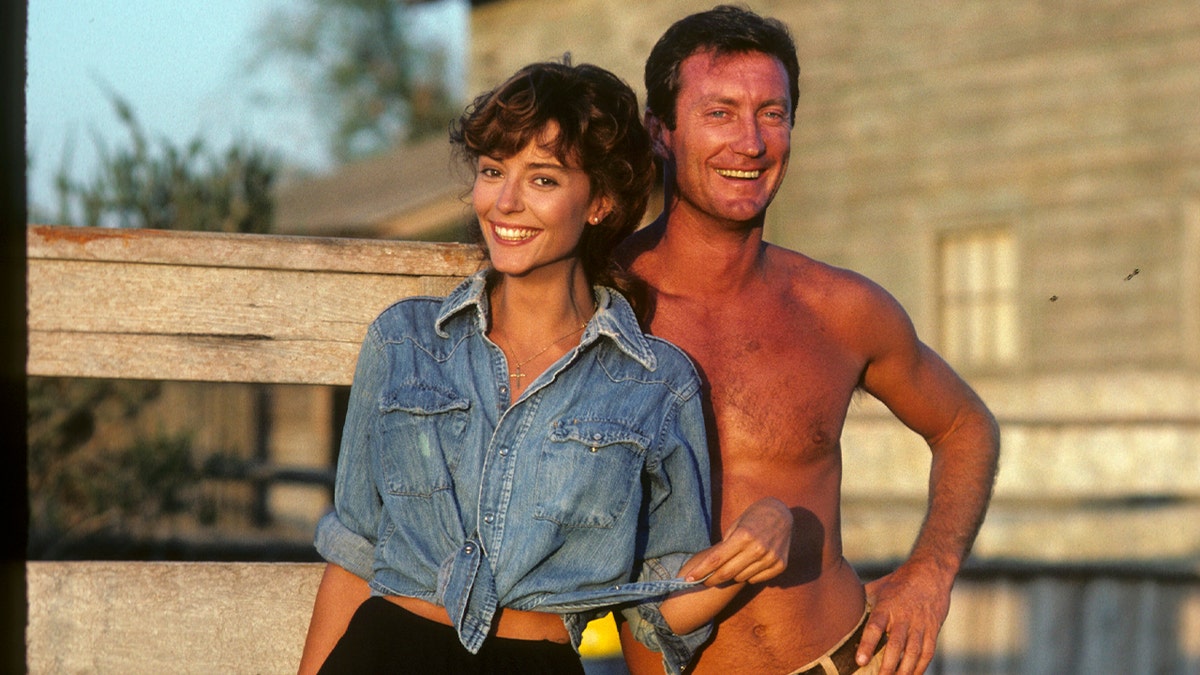 Rachel Ward and Bryan Brown standing together in a scene from The Thorn Birds