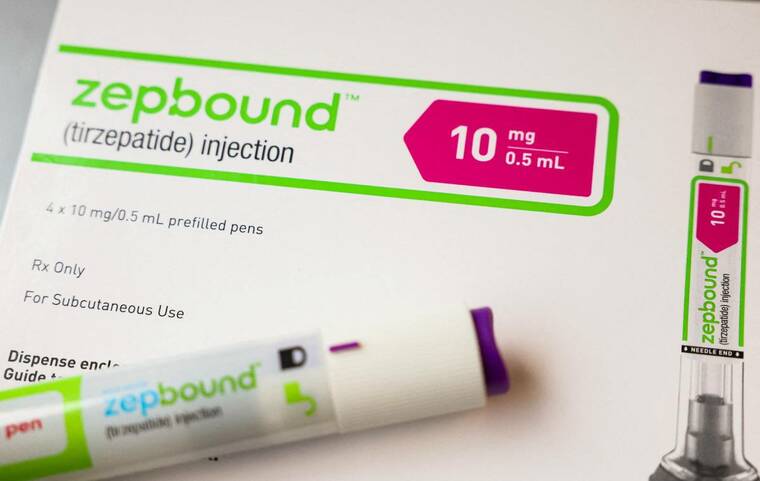REUTERS/BRENDAN MCDERMID/FILE PHOTO
An injection pen of Zepbound, Eli Lillys weight loss drug, is displayed in New York City in December 2023. CVS Health will restore Eli Lillys weight-loss injection Zepbound to its list of covered drugs and also add the drugmakers newly approved obesity pill, Foundayo, it said today.