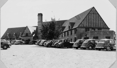 wellshire inn building with old cars