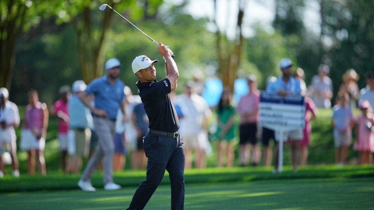 Xander Schauffele taking a golf shot on the second hole at Quail Hollow