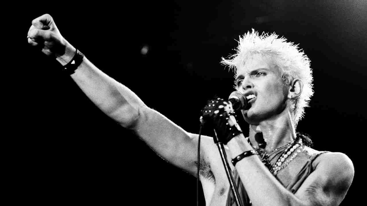 Billy Idol performing onstage in the 1980s