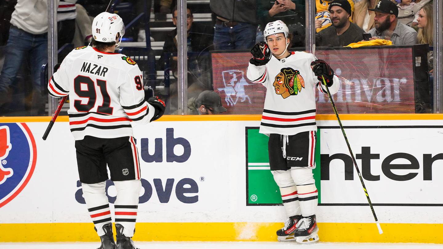 Jan 16, 2025; Nashville, Tennessee, USA;  Chicago Blackhawks center Connor Bedard (98) celebrates his goal with center Frank Nazar (91) against the Nashville Predators during the second period at Bridgestone Arena. Mandatory Credit: Steve Roberts-Imagn Images