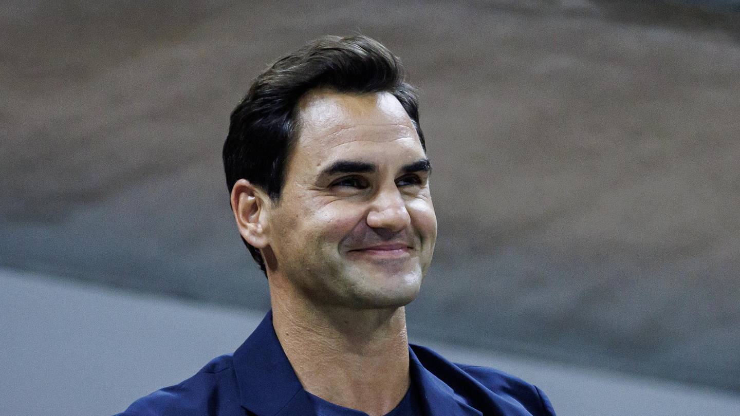 Roger Federer watches Aryna Sabalenka and smiles