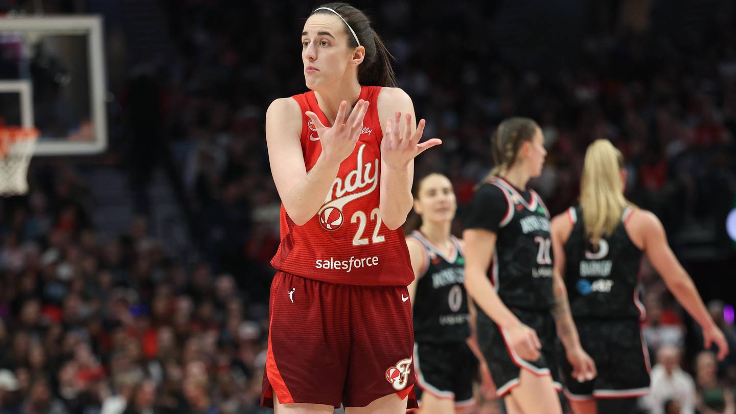May 30, 2026; Portland, Oregon, USA;  Indiana Fever guard Caitlin Clark (22) chats with a referee during the second half against the Portland Fire at Moda Center. Mandatory Credit: Jaime Valdez-Imagn Images