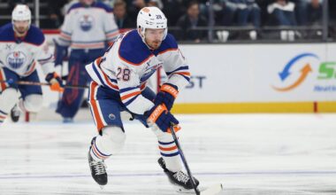 Apr 7, 2026; Salt Lake City, Utah, USA; Edmonton Oilers center Jack Roslovic (28) controls the puck against the Utah Mammoth during the second period at Delta Center. Mandatory Credit: Rob Gray-Imagn Images