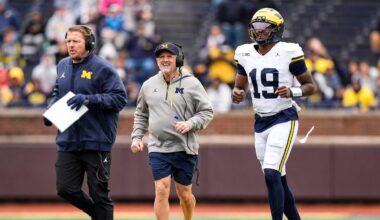 Michigan offensive coordinator Jason Beck, left, head coach Kyle Whittingham, center, and quarterback Bryce Underwood run across the field during the spring game at Michigan Stadium in Ann Arbor on Saturday, April 18, 2026.