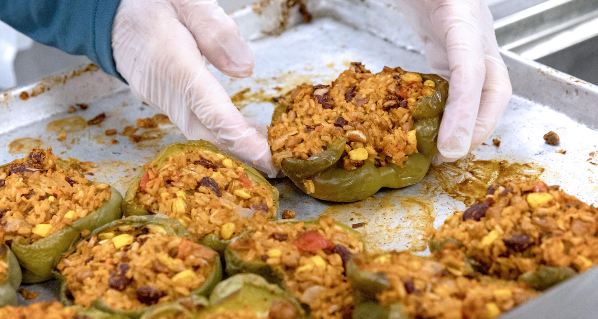 Volunteers prepare stuffed peppers at Community Servings in Jamaica Plain, on Jun. 1.