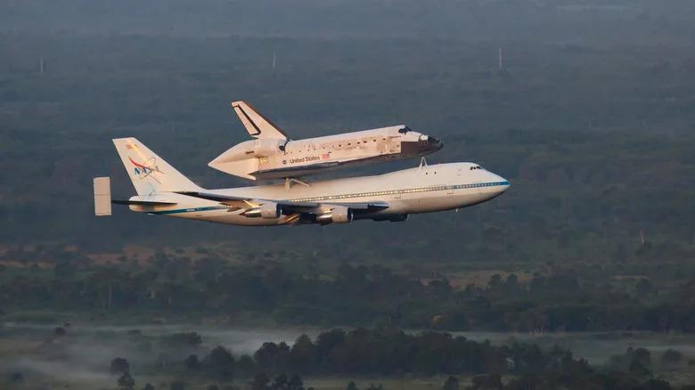 Space shuttle Discovery sits atop the Shuttle Aircraft Carrier on its last flight, to the Smithsonian.