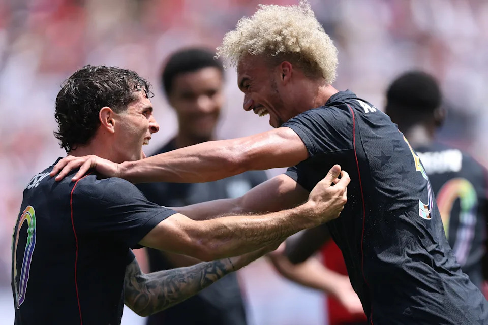 CHICAGO, ILLINOIS - JUNE 06: Antonee Robinson of United States celebrates with teammate Christian Pulisic after scoring his team's first goal during the international friendly match between United States and Germany at Soldier Field on June 06, 2026 in Chicago, Illinois. (Photo by Jamie Squire/Getty Images)