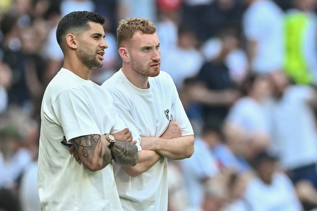Dejan Kulusevski (right) returned with captain Cristian Romero to watch Tottenham's final match of the season that saved their Premier League status
