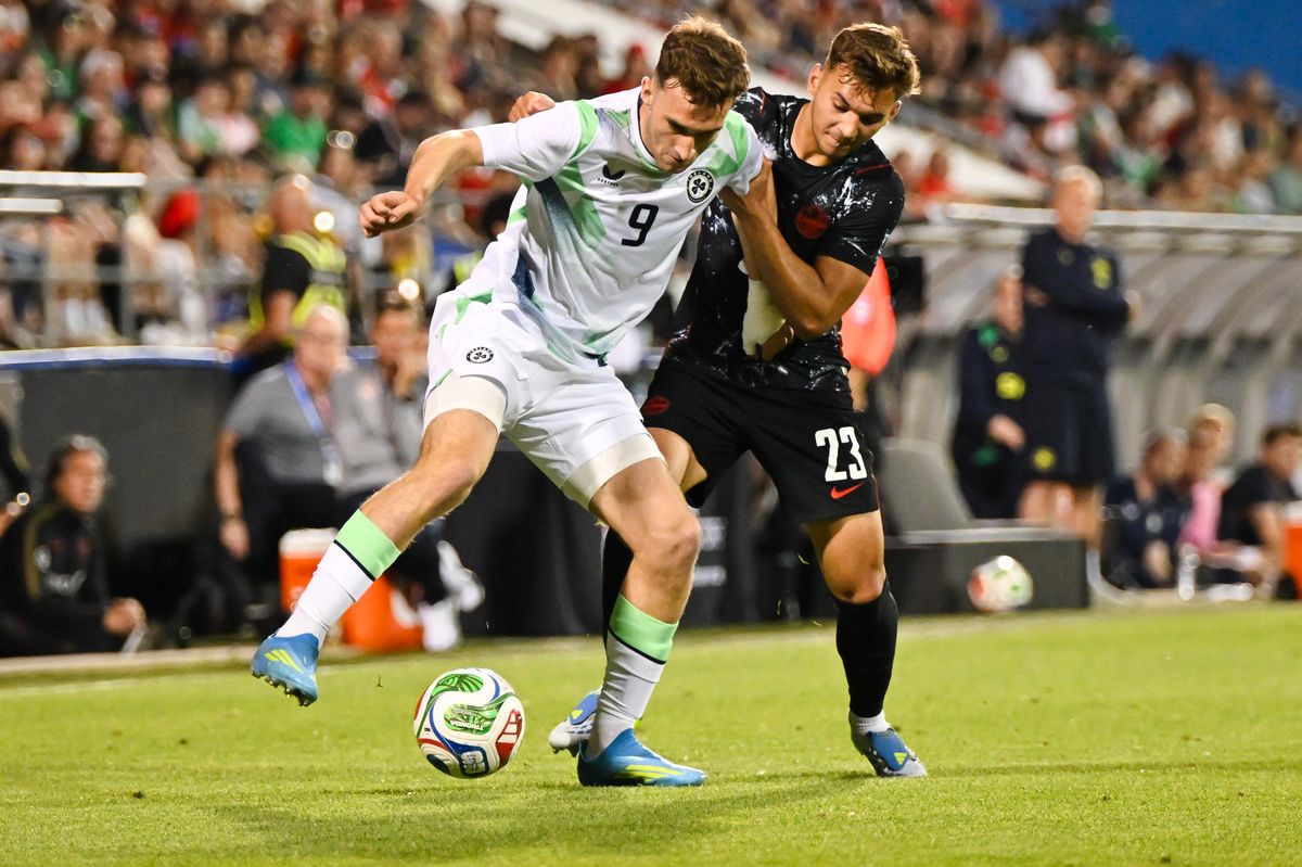 Mason Melia controls the ball against Niko Sigur during the international friendly match between Canada and the Republic of Ireland at Saputo Stadium in Montreal