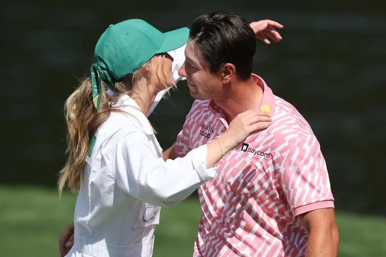 AUGUSTA, GEORGIA - APRIL 08: Viktor Hovland of Norway hugs Tuva Jensen on the ninth green during the Par Three Contest prior to the 2026 Masters Tournament at Augusta National Golf Club on April 08, 2026 in Augusta, Georgia. (Photo by Hector Vivas/Getty Images)