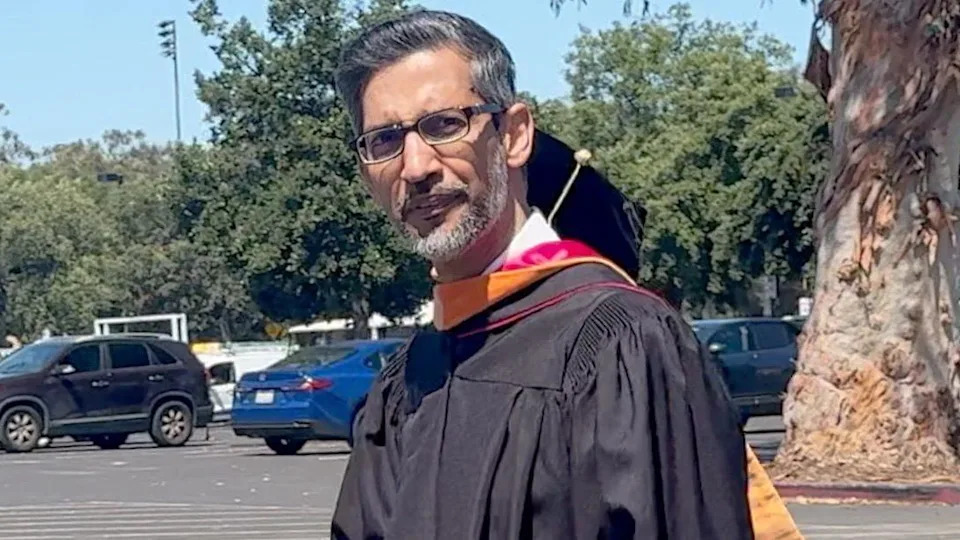 Sundar Pichai seen on the campus in a commencement gown