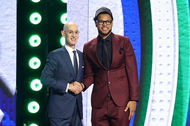 2026 NBA Draft - Round One NEW YORK, NEW YORK - JUNE 23: NBA commissioner Adam Silver shakes hands with Joshua Jefferson after he is drafted Twenty-eighth overall by the Minnesota Timberwolves during Round One of the 2026 NBA Draft at Barclays Center on June 23, 2026 in New York City. (Photo by Arturo Holmes/Getty Images)