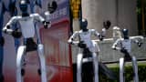 Unitree Robotics humanoids dance on May 31, 2026, in Shanghai, for the opening of Asia's first embodied intelligence experience store. 