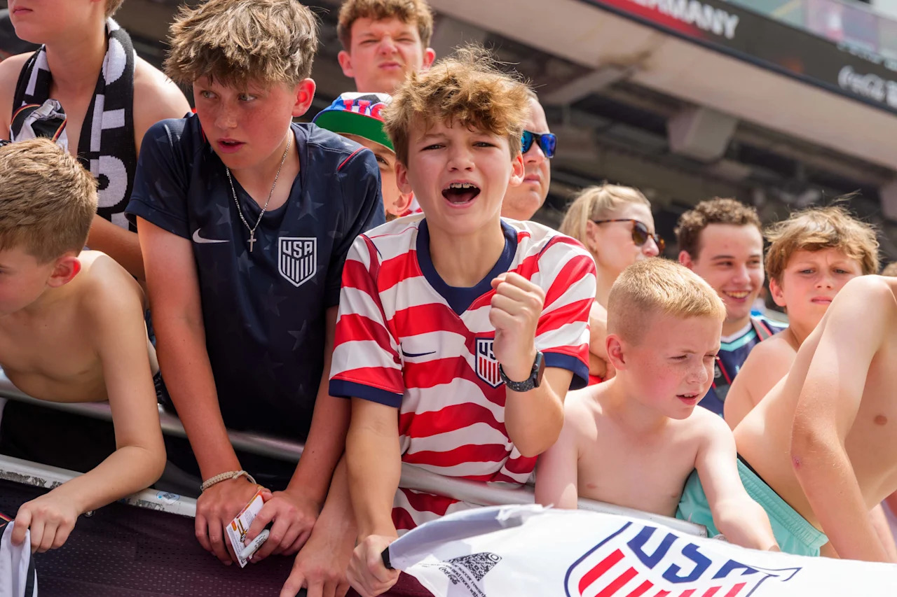 CHICAGO, ILLINOIS - JUNE 6: A young American soccer fan cheers before the international friendly match between United States and Germany at Soldier Field on June 6, 2026 in Chicago, Illinois. (Photo by Andrew J. Clark/ISI Photos/ISI Photos via Getty Images)