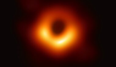 An image of the core region of Messier 87, a supermassive black hole, processed from a sparse array of radio telescopes known as the EHT with colours indicating brightness temperature (Credit : Event Horizon Telescope)