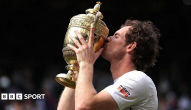 Andy Murray holding the Wimbledon trophy