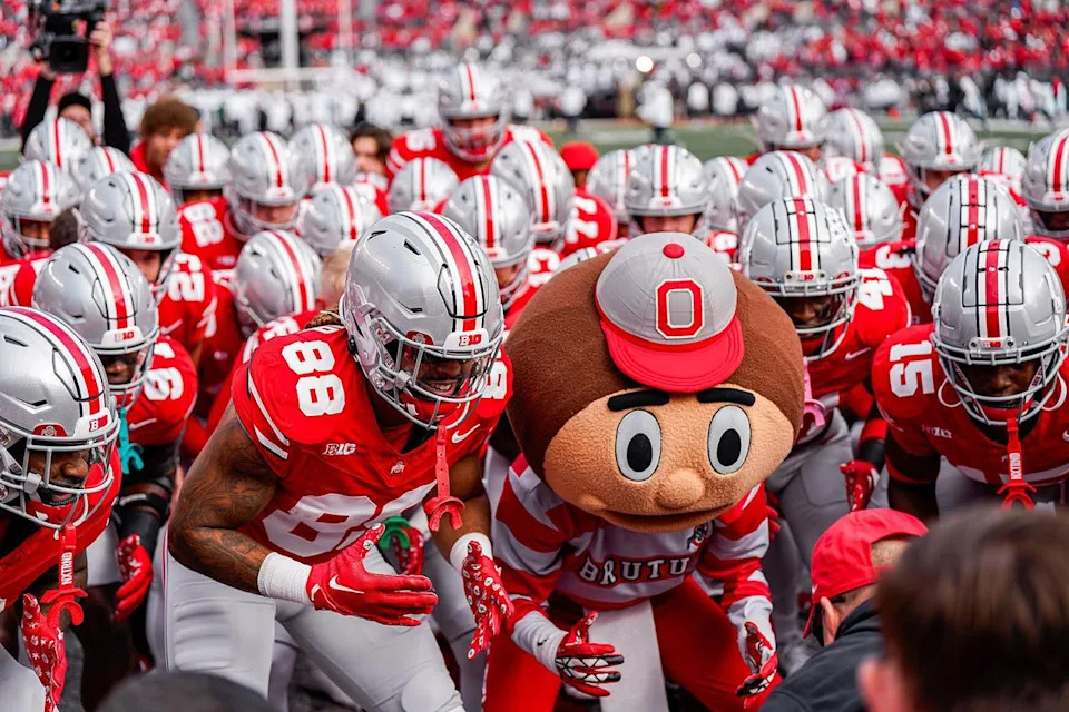 Emily Hayward in Brutus mascot with football teamCredit: @ohiostatefb