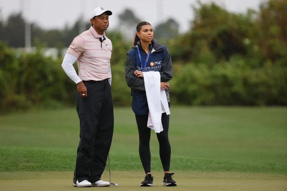 Tiger Woods with daughter Sam Woods on the third green during the first round of the PNC Championship