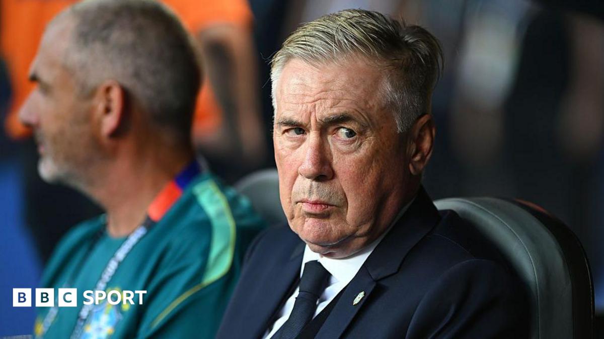 Brazil head coach Carlo Ancelotti sat in the dugout and looking to his left with a slight raised eyebrow before their World Cup match against Morocco