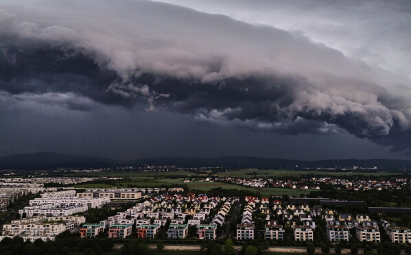 A thunder storm approaches the outskirts of Frankfurt, Germany, Sunday, May 31, 2026. (AP Photo/Michael Probst)