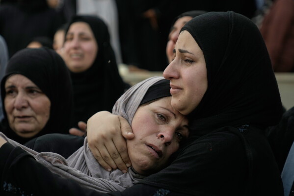Sabah Ishtayeh, center, mother of of Palestinian Imad Haroun Ishtayeh, 26, who was shot and killed by Israeli forces on Sunday at a concrete barrier separating the occupied West Bank from Jerusalem, cries during his funeral in the village of Salem, east of Nablus, Sunday, May 31, 2026. (AP Photo/Majdi Mohammed)