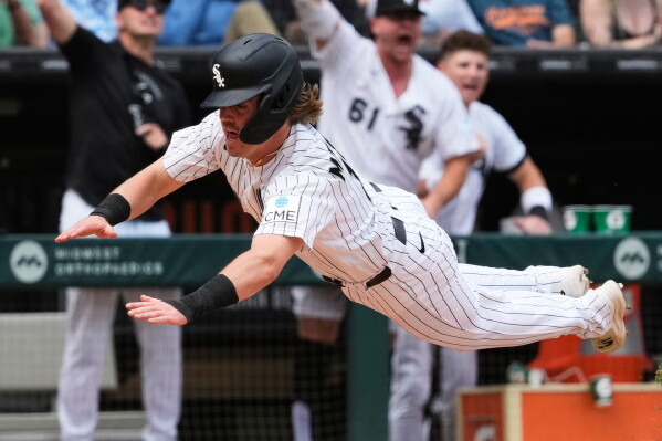 Chicago White Sox's Chase Meidroth scores on a one-run single by Tristan Peters during the seventh inning of a baseball game against the Detroit Tigers in Chicago, Sunday, May 31, 2026. (AP Photo/Nam Y. Huh)