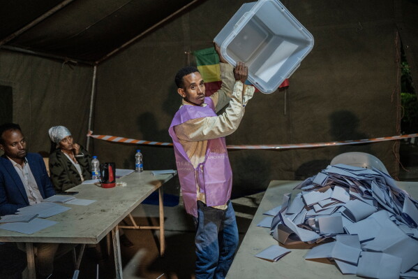 National Election Board of Ethiopia officials sort and count ballots at the Shalla Park polling station during the general election in Addis Ababa, Ethiopia, Tuesday, June 2, 2026. (AP Photo/Amanuel Sileshi)