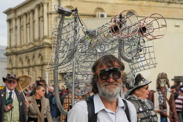 A participant reacts as he marches in a parade at the Steampunk NZ Festival in Ōamaru, New Zealand, on May 30 2026. (AP Photo/Charlotte Graham-McLay)